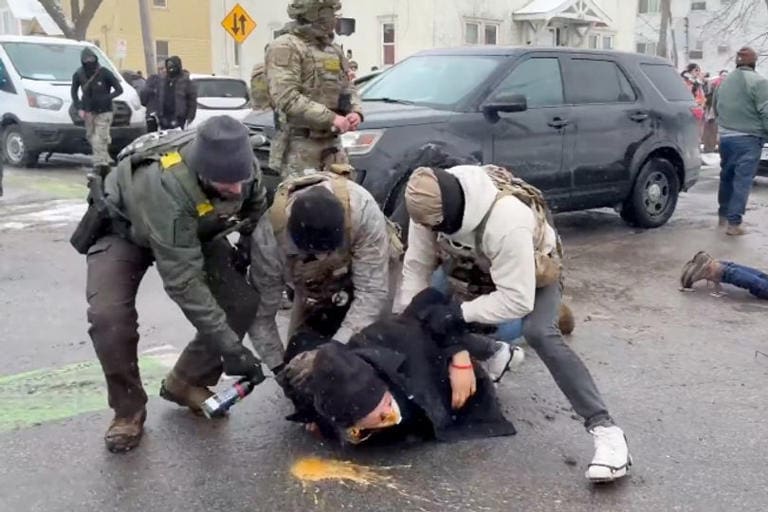 ICE sprays detained protestor in the face with pepper spray